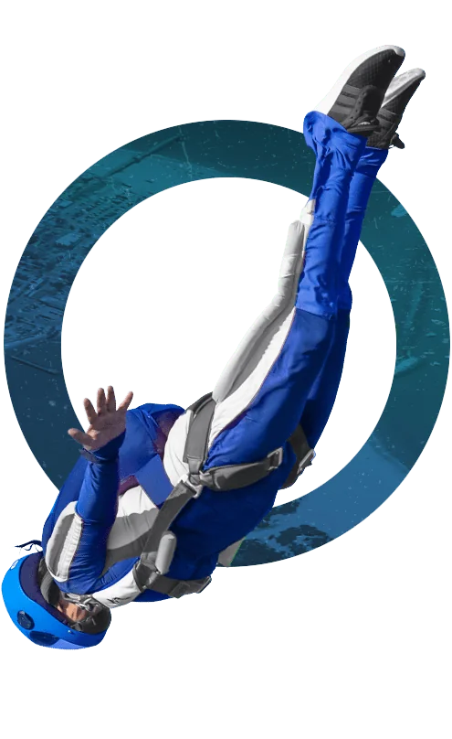 a man laying on his back on top of a blue object