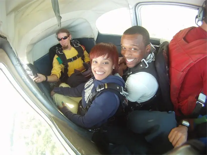 a group of people riding in the back of a van