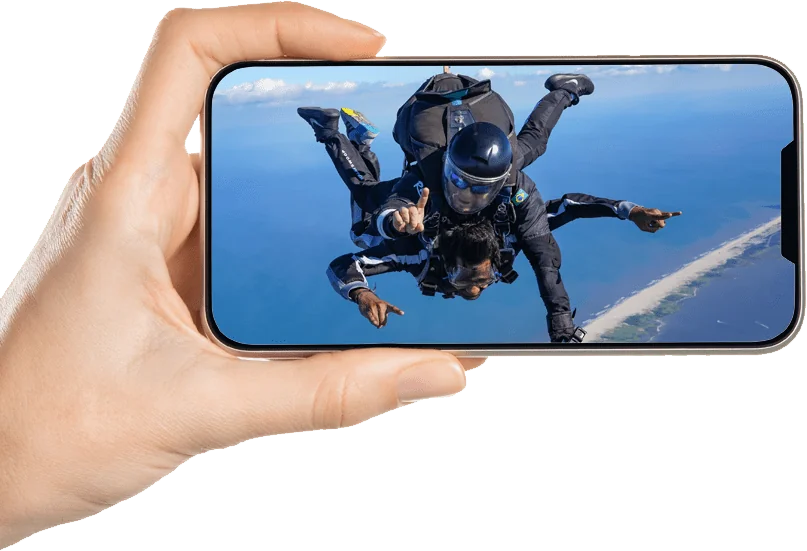 a person taking a picture of a person in a diving suit